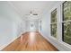 Bright bedroom with hardwood floors and large windows at 321 S Brooksville Ave, Brooksville, FL 34601