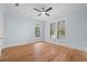 Bedroom with hardwood floors, ceiling fan and light blue walls at 321 S Brooksville Ave, Brooksville, FL 34601