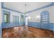 Elegant dining room with hardwood floors, chandelier, and built-in hutch at 321 S Brooksville Ave, Brooksville, FL 34601