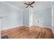 Light blue walls and hardwood floors in bedroom at 321 S Brooksville Ave, Brooksville, FL 34601