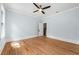 Spacious bedroom with hardwood floors and access to hallway at 321 S Brooksville Ave, Brooksville, FL 34601