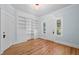 Bright office with built-in shelving and hardwood floors at 321 S Brooksville Ave, Brooksville, FL 34601