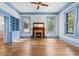 Spacious living room features hardwood floors, built-in shelving, and a fireplace at 321 S Brooksville Ave, Brooksville, FL 34601