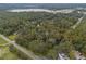 Aerial view of a quiet rural landscape with lake and trees at 14335 Snow Memorial Hwy, Brooksville, FL 34601
