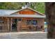 Lake Lindsey Thrill & Deli, brick building with outdoor seating at 14335 Snow Memorial Hwy, Brooksville, FL 34601