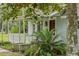 Light blue house with white porch at 14335 Snow Memorial Hwy, Brooksville, FL 34601