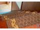 Close-up showing detail of worn wooden stairs with patterned carpet runners at 14335 Snow Memorial Hwy, Brooksville, FL 34601