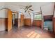 Attic bedroom with wood floors, wood paneling, and ceiling fan at 14335 Snow Memorial Hwy, Brooksville, FL 34601