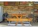 Rustic wooden picnic table with condiment holder at 14335 Snow Memorial Hwy, Brooksville, FL 34601