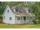 Light blue house with white porch at 14335 Snow Memorial Hwy, Brooksville, FL 34601