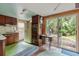 View of retro kitchen with vintage appliances and access to backyard at 14335 Snow Memorial Hwy, Brooksville, FL 34601