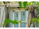 White shed with light blue doors and deer skulls at 14335 Snow Memorial Hwy, Brooksville, FL 34601