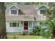 Light blue house with white porch at 14335 Snow Memorial Hwy, Brooksville, FL 34601
