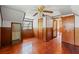 Spacious attic bedroom with wood floors, ceiling fan and ample closet space at 14335 Snow Memorial Hwy, Brooksville, FL 34601