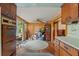 Kitchen with vintage cabinetry and a view to the living room at 14335 Snow Memorial Hwy, Brooksville, FL 34601