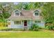 Light blue house with white porch at 14335 Snow Memorial Hwy, Brooksville, FL 34601