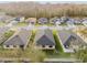 An aerial view showcasing the neighborhood's well-maintained homes, streets, and mature trees at 11512 Weaver Hollow Rd, New Port Richey, FL 34654