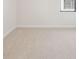 Bedroom with carpet, baseboard trim, one window with blinds, and neutral paint at 11512 Weaver Hollow Rd, New Port Richey, FL 34654