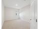 Bedroom features carpeted flooring, one window, and doorway to hallway at 11512 Weaver Hollow Rd, New Port Richey, FL 34654