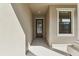 Covered walkway to front door with privacy glass at 11512 Weaver Hollow Rd, New Port Richey, FL 34654