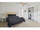 Main bedroom with black bedding, ceiling fan and walk-in closet at 313 Crystal Beach Ave, Crystal Beach, FL 34681