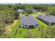Overhead view of property showcases mature landscaping, backing up to nature and other well-kept neighboring homes at 6109 Dusk Rose Ln, Brooksville, FL 34601
