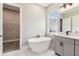 Elegant bathroom featuring a soaking tub and modern vanity at 6109 Dusk Rose Ln, Brooksville, FL 34601