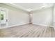 Spacious bedroom with wood floors, neutral walls, and ample natural light at 6109 Dusk Rose Ln, Brooksville, FL 34601