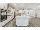Bright kitchen with a large island, stainless steel appliances, and pendant lighting at 6109 Dusk Rose Ln, Brooksville, FL 34601