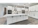 Bright kitchen with island, stainless steel appliances and white countertops at 6109 Dusk Rose Ln, Brooksville, FL 34601
