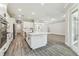 Island kitchen with white cabinetry, and stainless steel appliances at 6109 Dusk Rose Ln, Brooksville, FL 34601