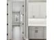 Bright kitchen with white cabinets and gray lower cabinets and stainless hardware at 6109 Dusk Rose Ln, Brooksville, FL 34601