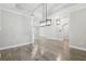 Open living space with wood flooring and recessed lighting and modern light fixtures throughout at 6109 Dusk Rose Ln, Brooksville, FL 34601
