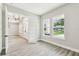 Bright office with gray walls, wood floors, and views of the outdoors at 6109 Dusk Rose Ln, Brooksville, FL 34601