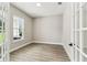 Bright office space with wood floors, white trim and large windows at 6109 Dusk Rose Ln, Brooksville, FL 34601