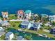 Aerial view of waterfront neighborhood featuring beautiful views of homes and canals at 6428 Driftwood Dr, Hudson, FL 34667