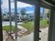 Waterfront backyard view from patio, featuring brick pathway at 6428 Driftwood Dr, Hudson, FL 34667