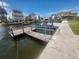 Private dock with boat lift, perfect for waterfront living and enjoying the water at 6428 Driftwood Dr, Hudson, FL 34667