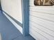 Exterior view of a white wall and white garage door at 6428 Driftwood Dr, Hudson, FL 34667