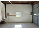 Spacious garage with durable concrete floor and natural light at 6428 Driftwood Dr, Hudson, FL 34667