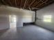 Expansive garage with ample natural light, concrete floor, and potential for workshop or storage space at 6428 Driftwood Dr, Hudson, FL 34667