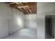 Large garage space with unfinished ceiling and concrete flooring, offering potential for versatile use at 6428 Driftwood Dr, Hudson, FL 34667