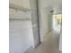 Hallway with beadboard paneling leads to other rooms of the house at 6428 Driftwood Dr, Hudson, FL 34667