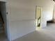 Bright, spacious interior featuring classic wainscoting throughout at 6428 Driftwood Dr, Hudson, FL 34667
