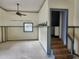 Spacious living room featuring a ceiling fan, neutral paint and window at 6428 Driftwood Dr, Hudson, FL 34667