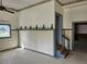 Living room featuring neutral paint, window and staircase at 6428 Driftwood Dr, Hudson, FL 34667