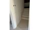 Bright stairway featuring classic wainscoting that leads upstairs at 6428 Driftwood Dr, Hudson, FL 34667