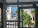Water view from a screened-in porch with outdoor ambiance and a peek of the neighborhood at 6428 Driftwood Dr, Hudson, FL 34667