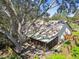 Screened patio and fenced backyard with a large oak tree at 9142 Brooker Dr, New Port Richey, FL 34655