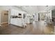 Bright kitchen with white cabinets, stainless steel appliances, and a large island at 9142 Brooker Dr, New Port Richey, FL 34655